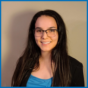 Alexi Gladue smiles at the camera.