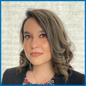 Isra Tanweer smiles at the camera.