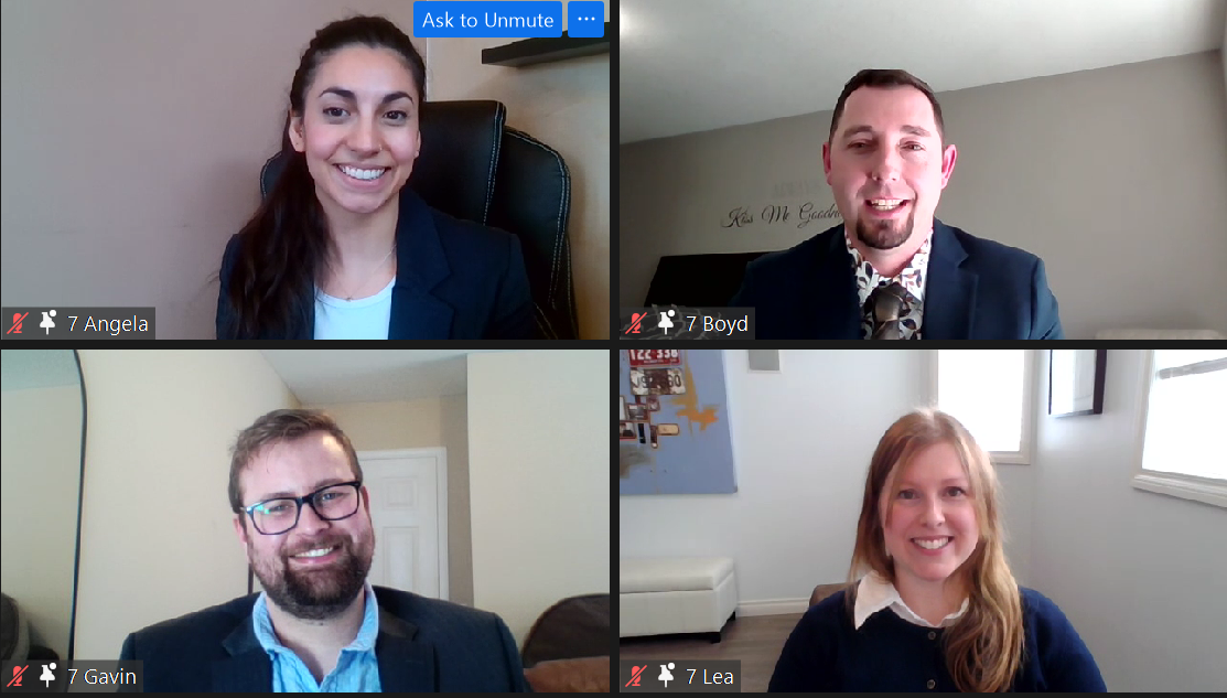 A screenshot of a Zoom meeting with four smiling students.