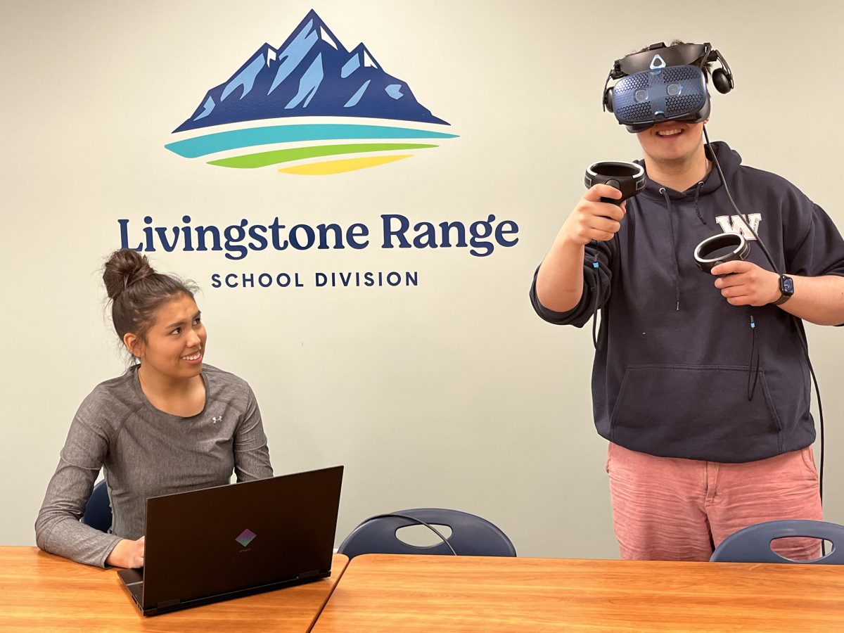 Grade 12 students Carson Smith (seated) and Robert Beranek from FP Walshe High School in Fort Macleod are super excited to try the new virtual reality career exploration tool.