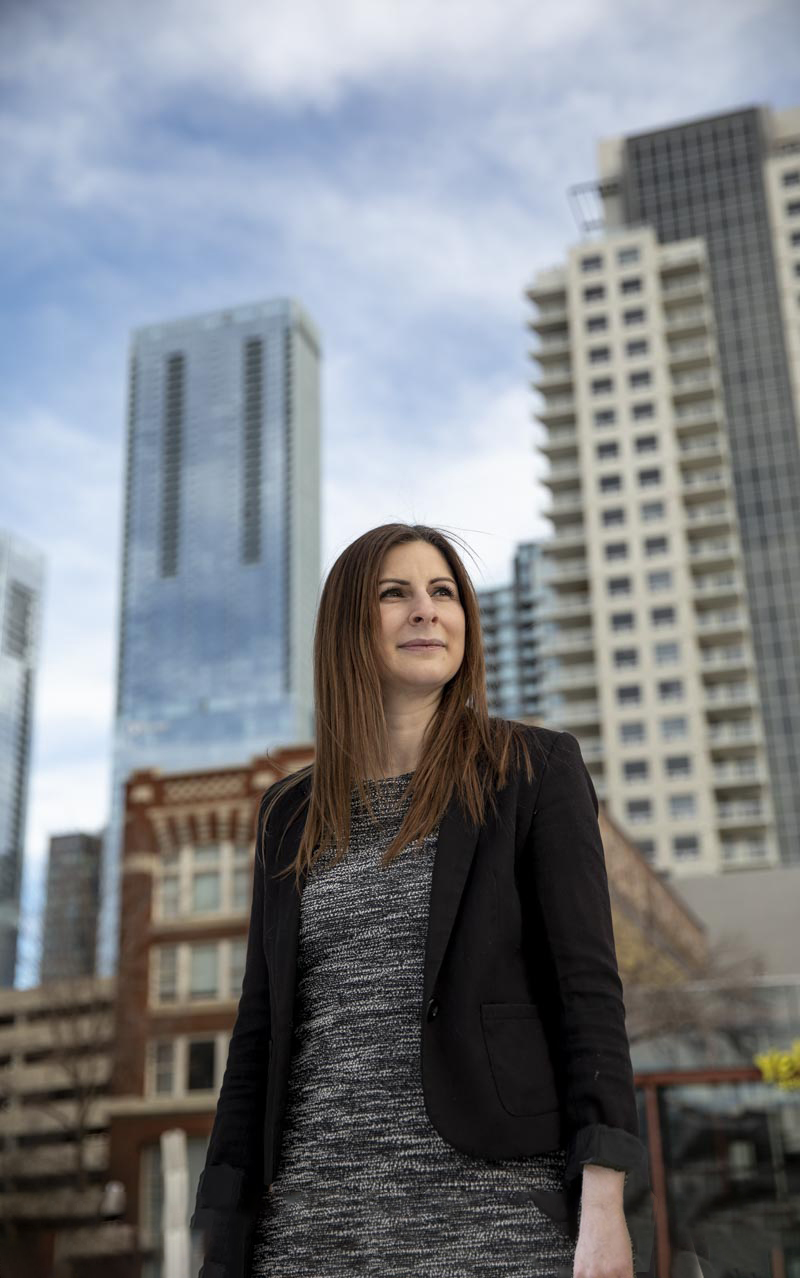 Megan Boe CPA standing outside with buildings visible behind her