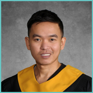 Abdul Andres is smiling at the camera. He is wearing a graduation gown with a yellow stole.