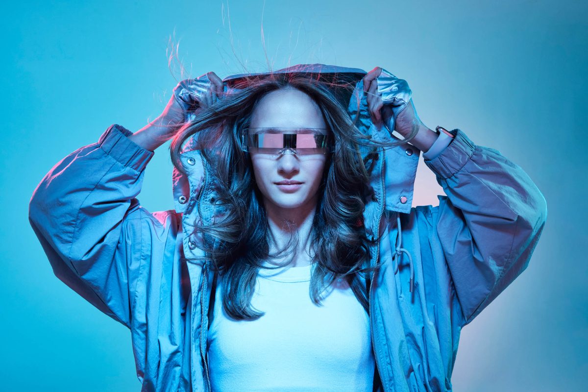 A person in futuristic clothing poses.
