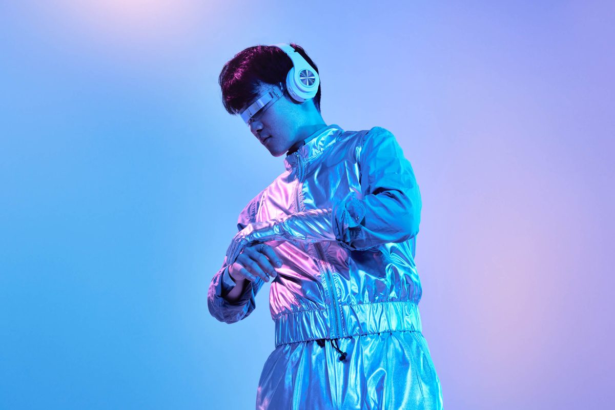 A person in futuristic clothing poses.
